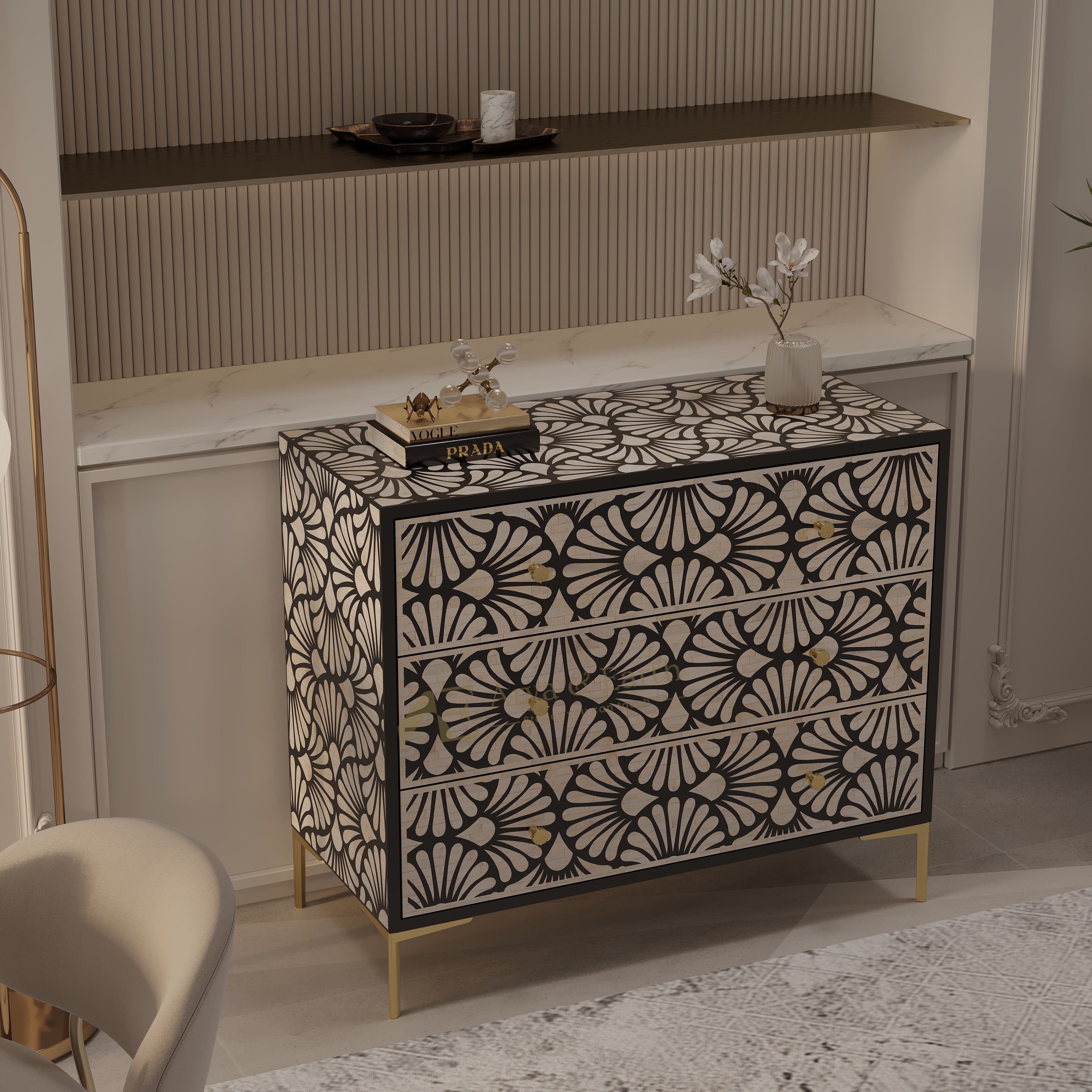 A two-drawer sideboard cabinet with a black and beige Art Deco fan pattern and gold legs, styled in a modern interior setting.