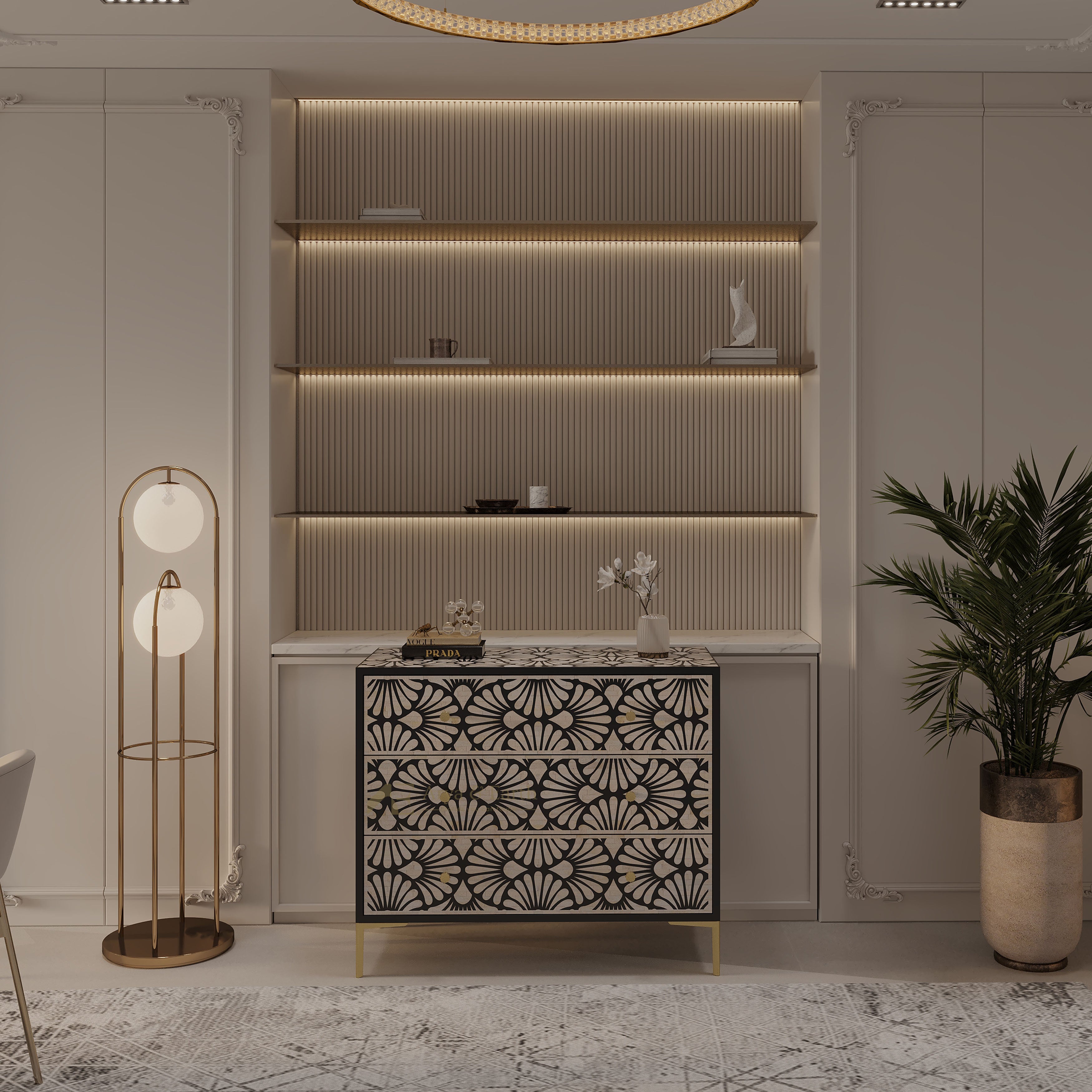 A modern interior scene featuring a decorative black and white patterned console cabinet with gold legs, set against a ribbed beige wall with built-in shelves and warm LED lighting. A tall floor lamp stands on the left, and a potted palm in a metallic pot stands on the right.