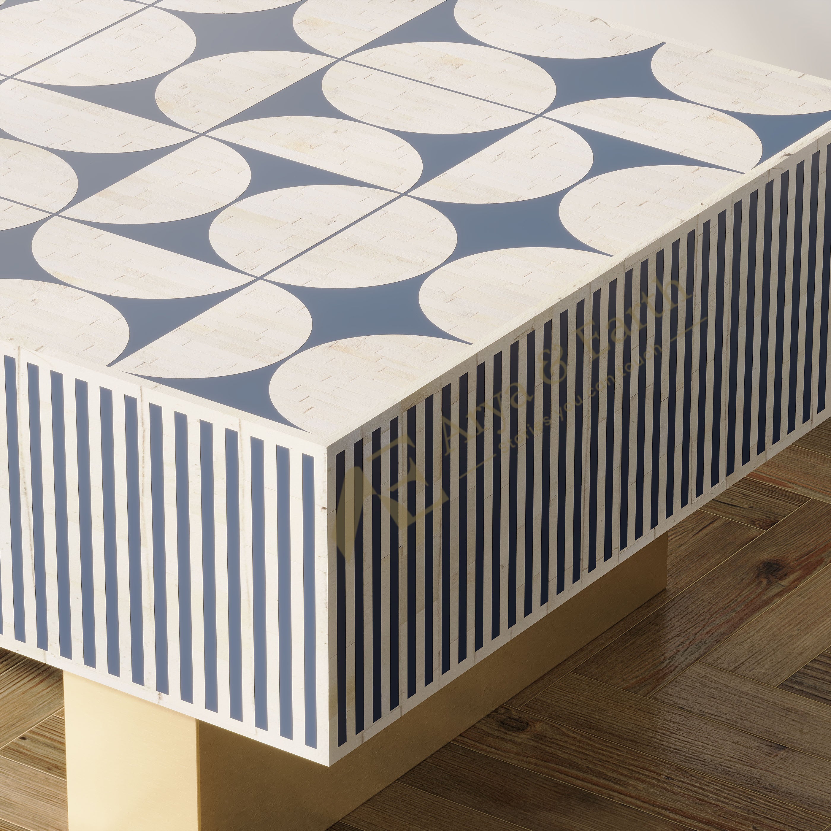 A modern rectangular table with a geometric patterned top and striped sides, featuring a blue and off-white design with a light wood leg, shown on a wooden floor.