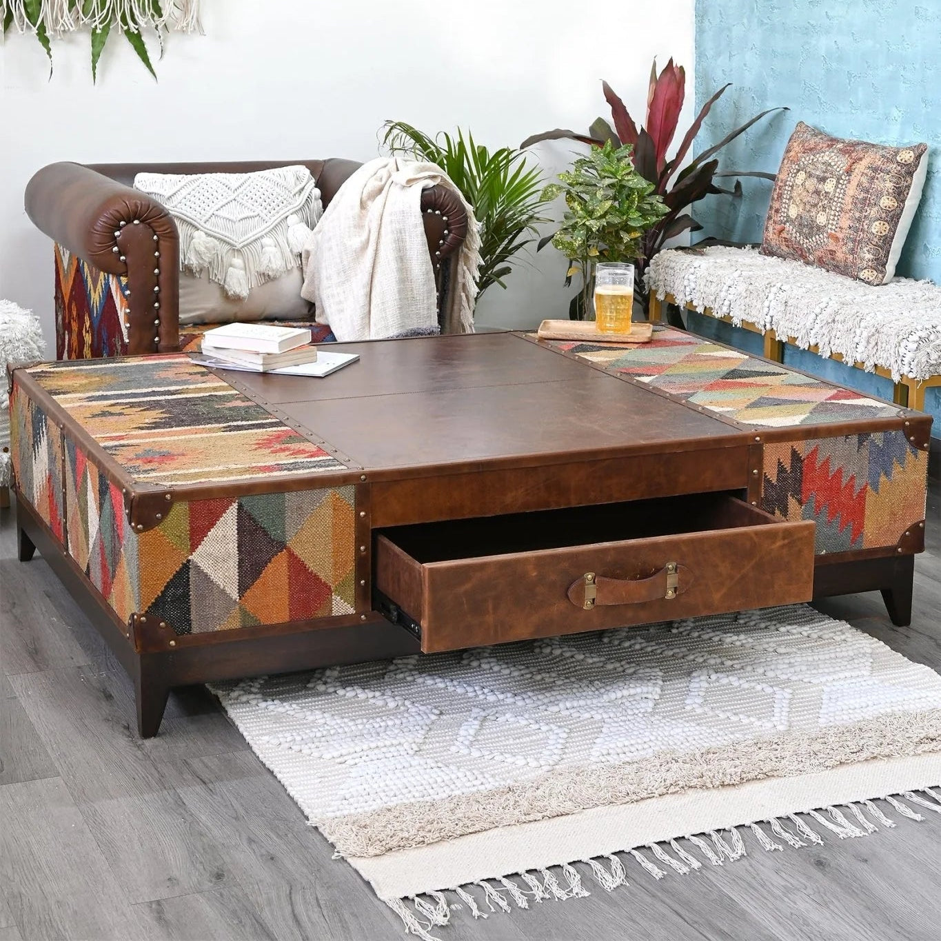 Decorative coffee table with geometric kilim design in a living room setting.