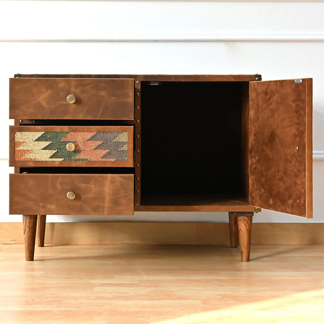 Wooden sideboard with open doors on a wooden floor