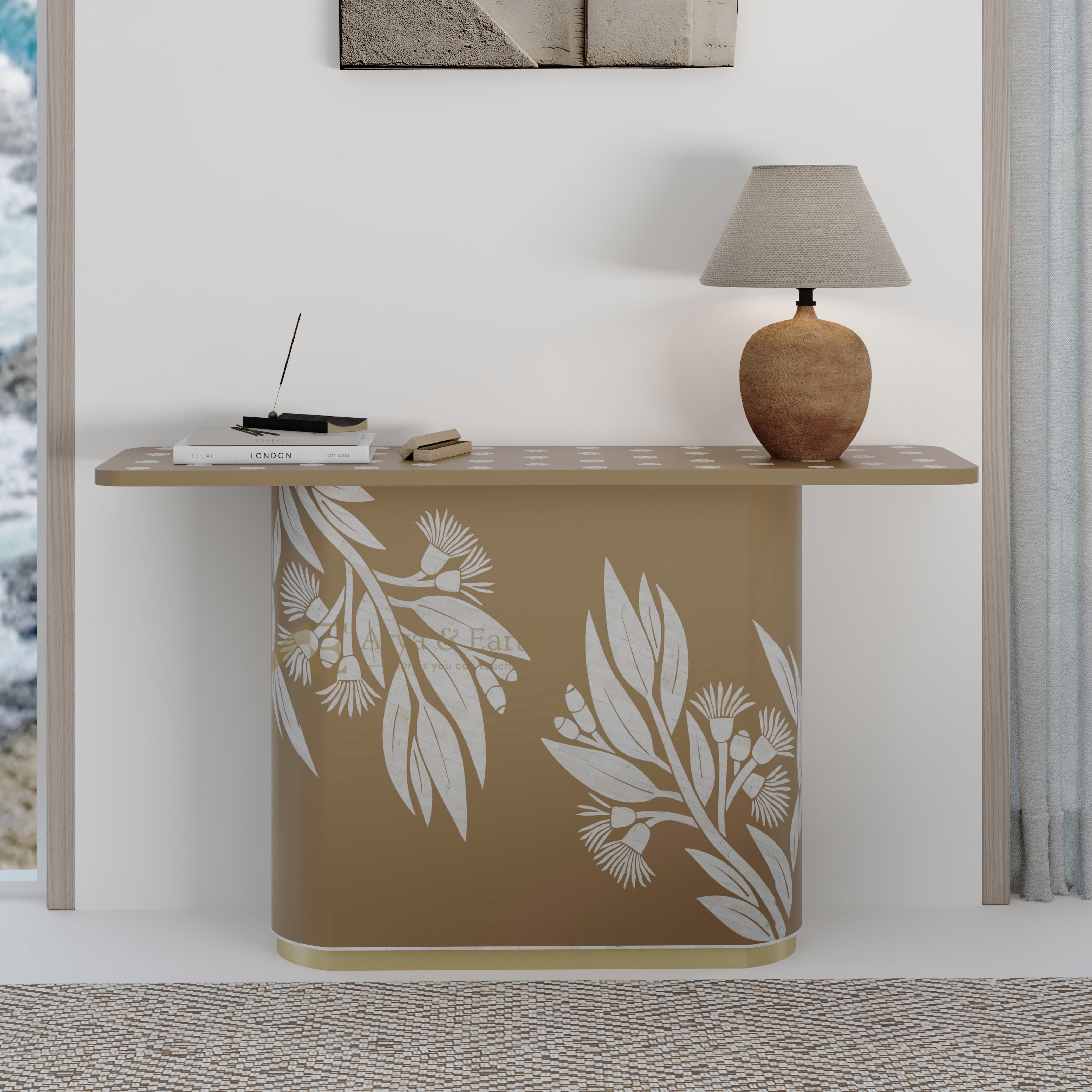 beige console table with floral patterns and a lamp in a room setting.