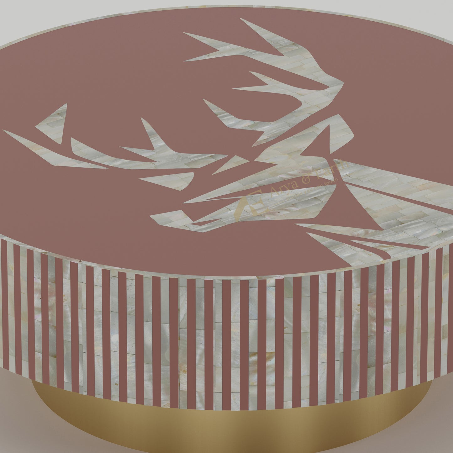 close up of mother of pearl round table with striped pattern and gold base
