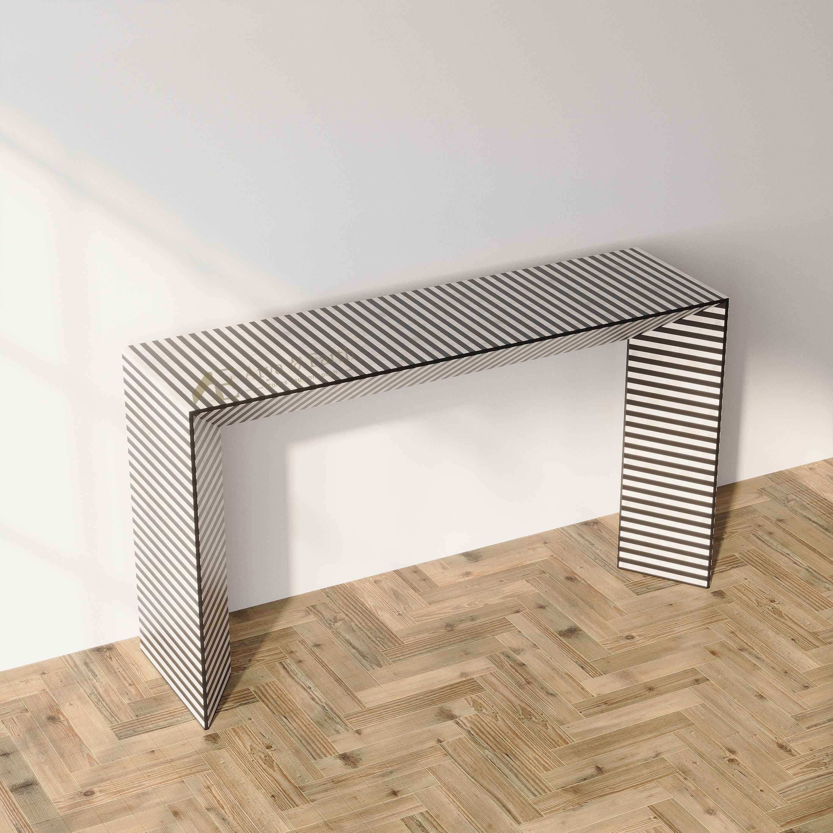 A modern console table with a rectangular top and sculptural legs, featuring a black and white striped pattern, set against a plain white wall on a light wood herringbone floor.