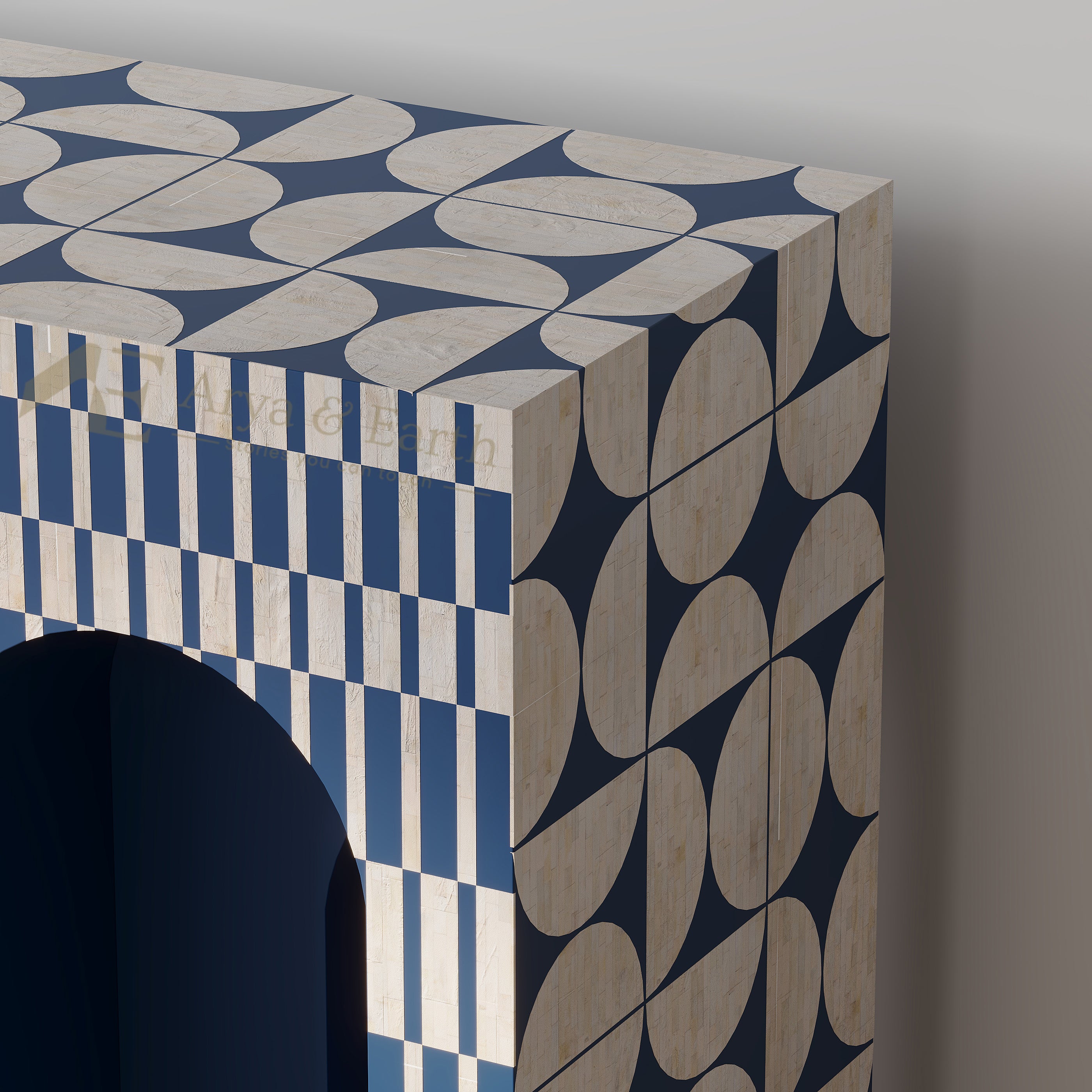 A close-up of a decorative cabinet or shelf corner featuring a geometric mosaic pattern in navy blue and cream, with vertical blue-and-white stripes on one side and a dark arched opening on the front.