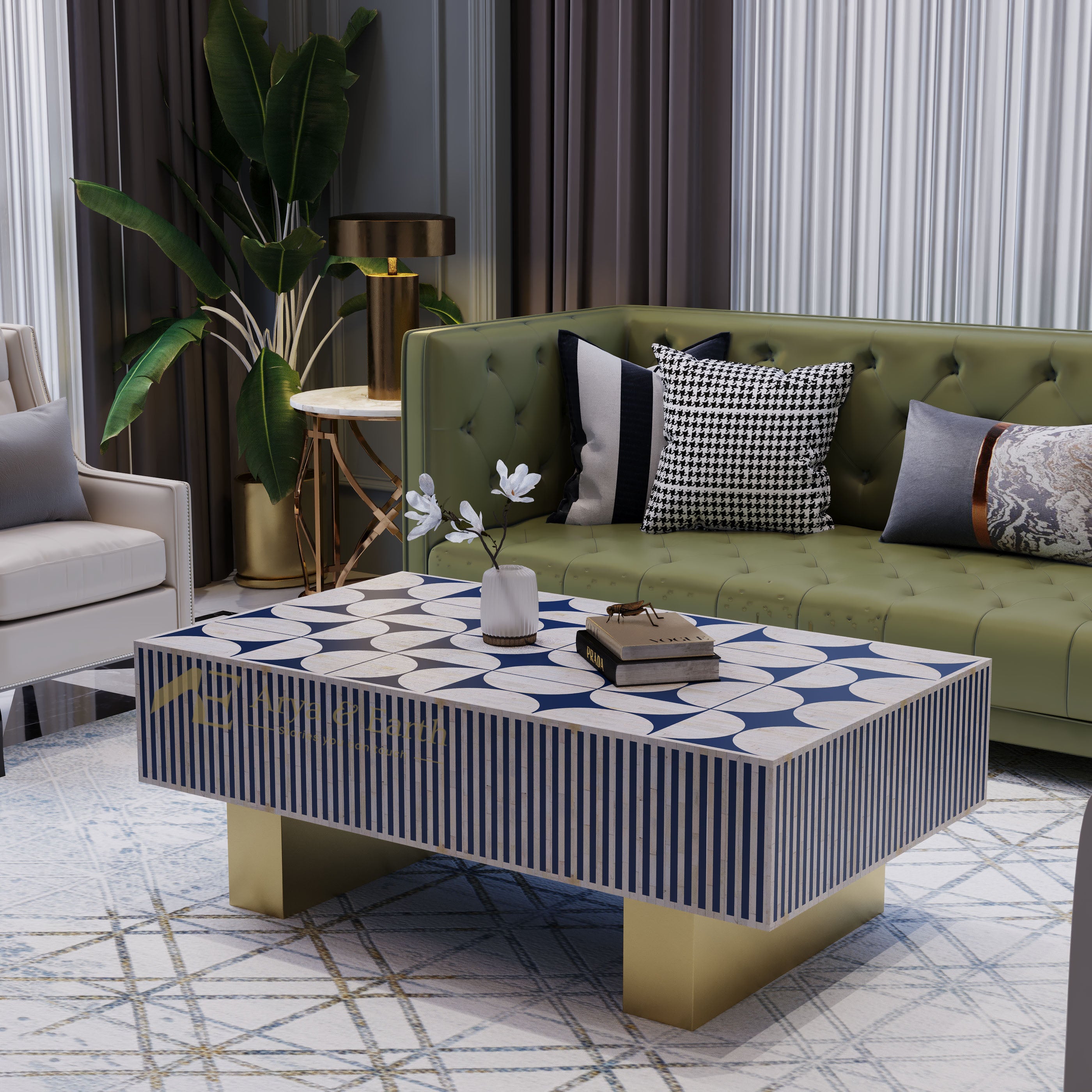 A modern rectangular coffee table with a blue and white geometric pattern top, striped sides, and gold legs, styled in a contemporary living room next to an olive green sofa.