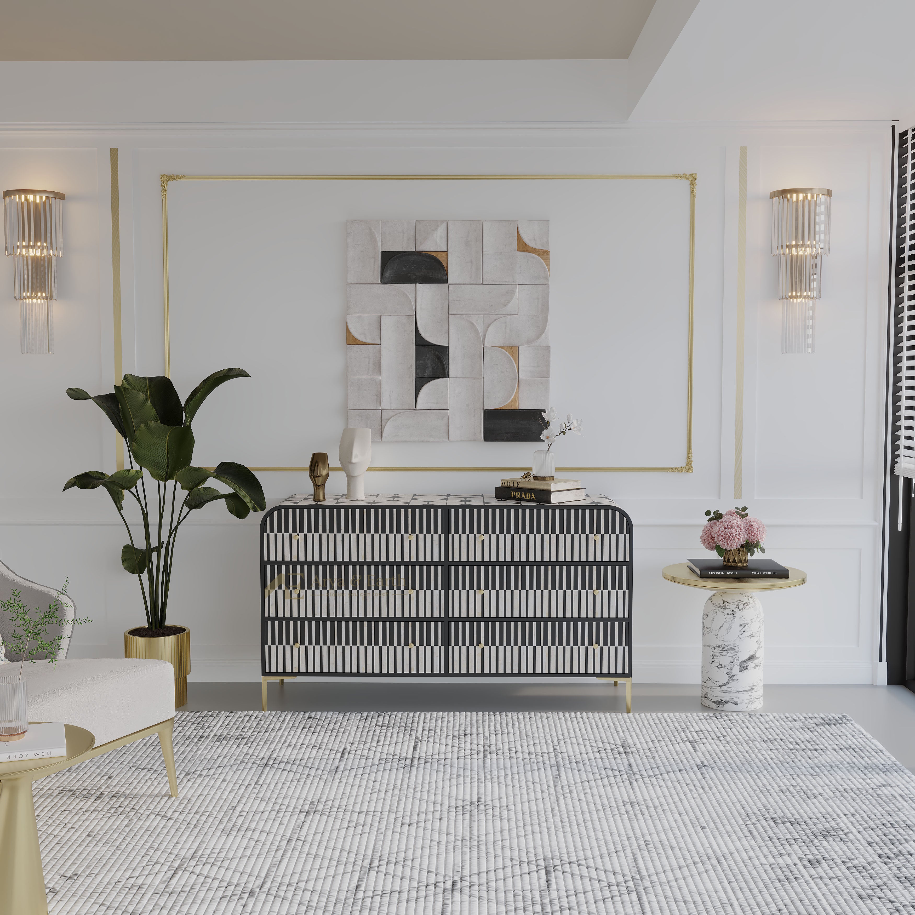 A modern living room setting featuring a black and white striped sideboard console with gold legs, styled with a large potted plant, a marble-topped side table, and a geometric abstract wall art piece framed in gold on a white wall.