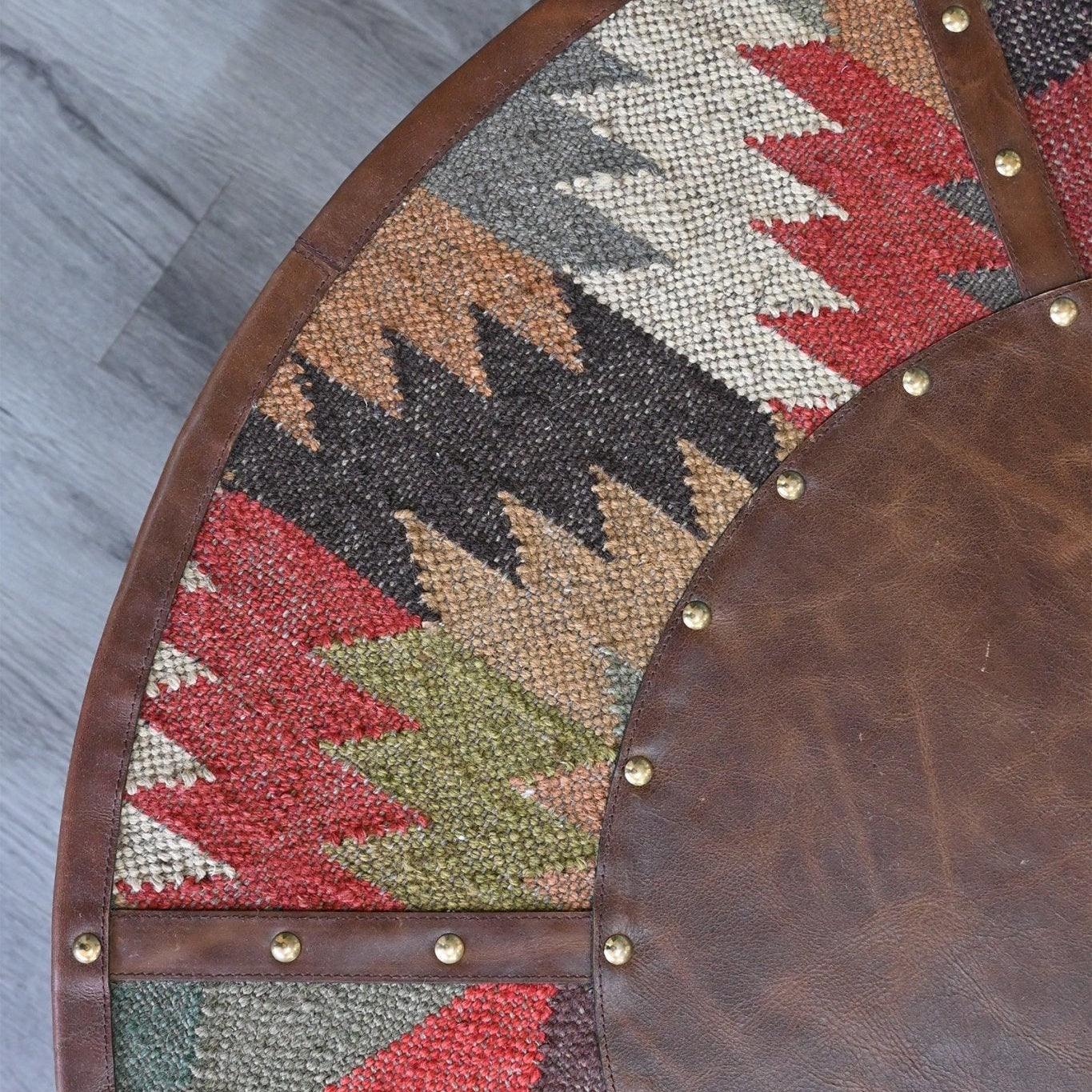 Round table with geometric pattern on a wooden floor