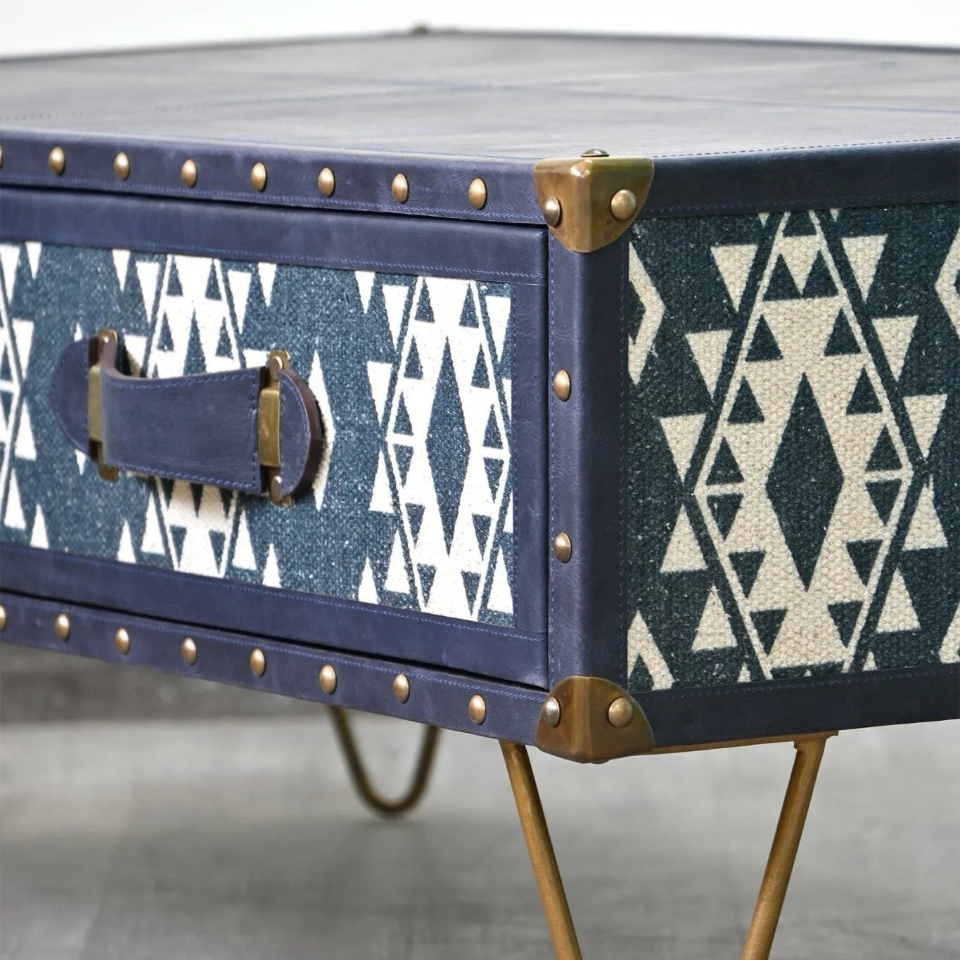 Navy Coffee Table with white geometric pattern on a gray background