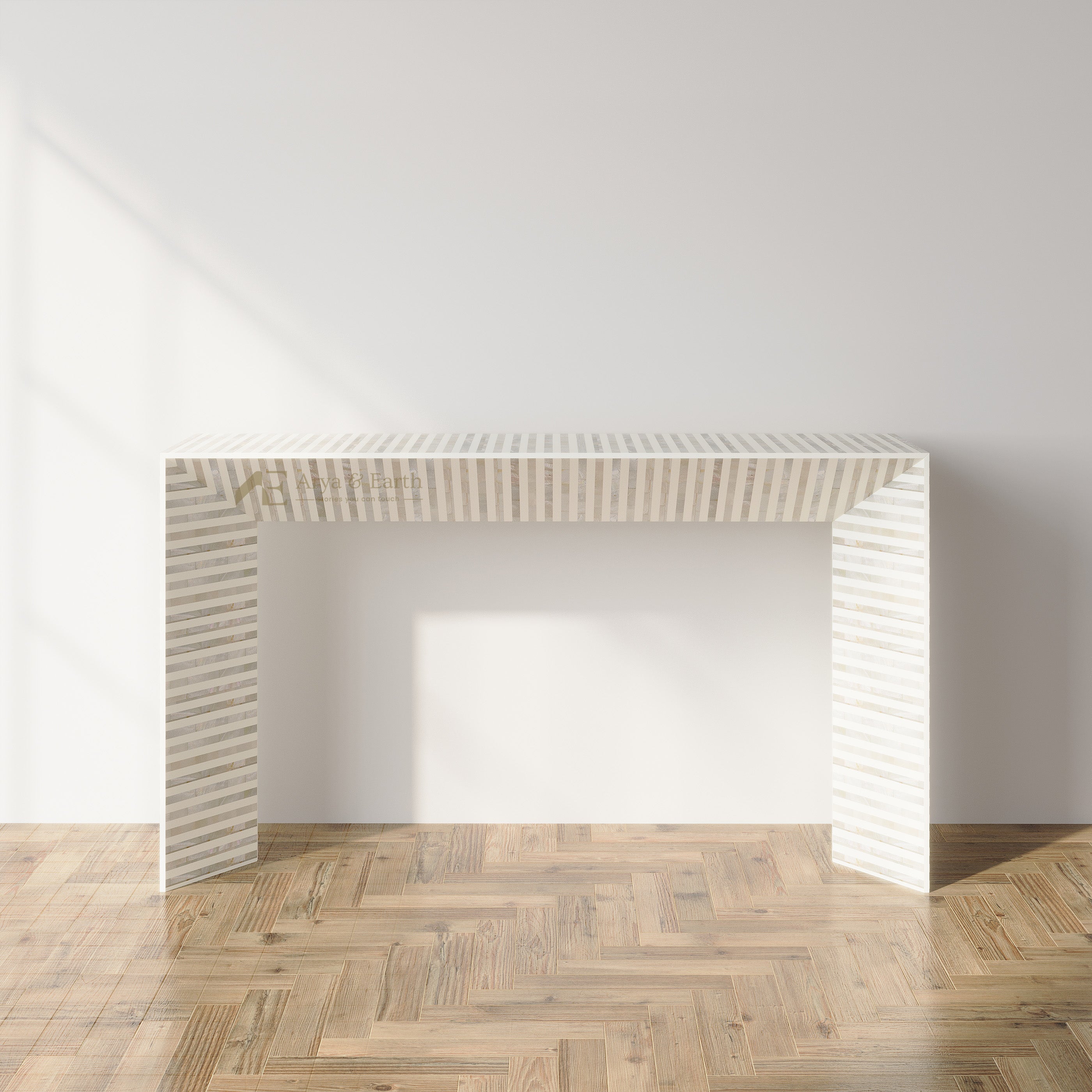 A modern white slatted console table with a rectangular top and open side panels, shown in a minimalist room with a light gray wall and herringbone wood floor.