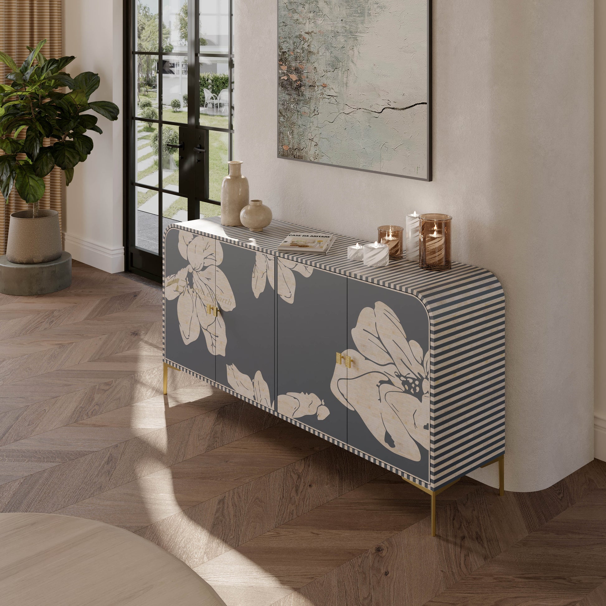 Mother of pearl inlay grey cabinet with floral and striped design in a room with plants and a painting.