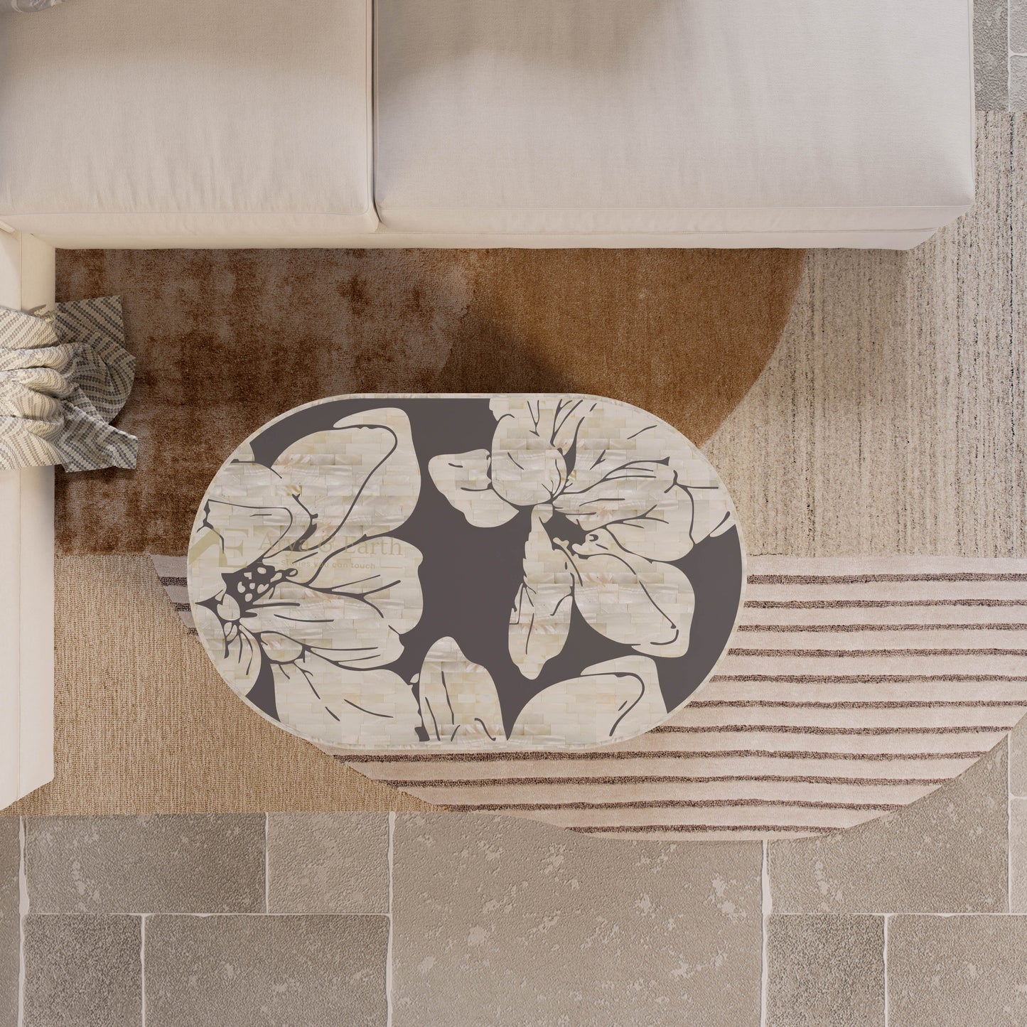 mother of pearl inlay grey coffee table on a neutral coloured rug.