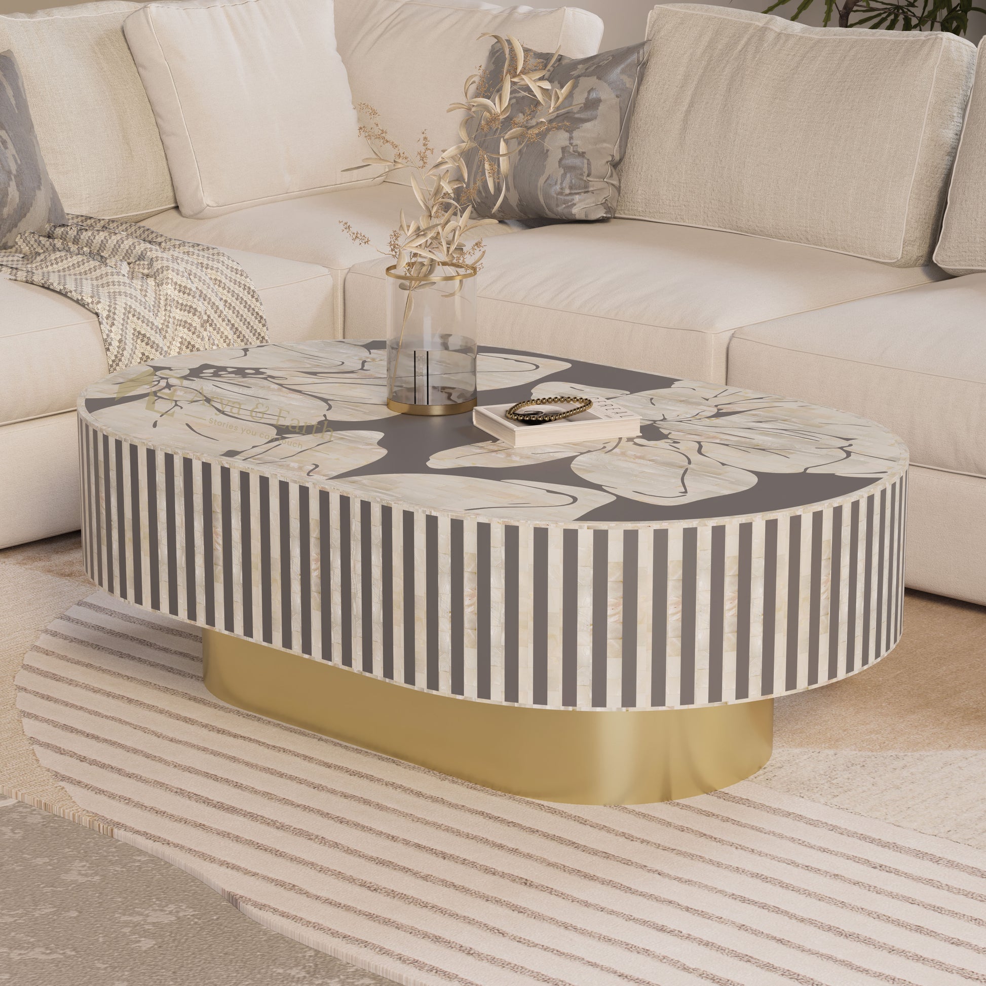 grey oblong coffee table with floral mother of pearl inlay design and gold base.