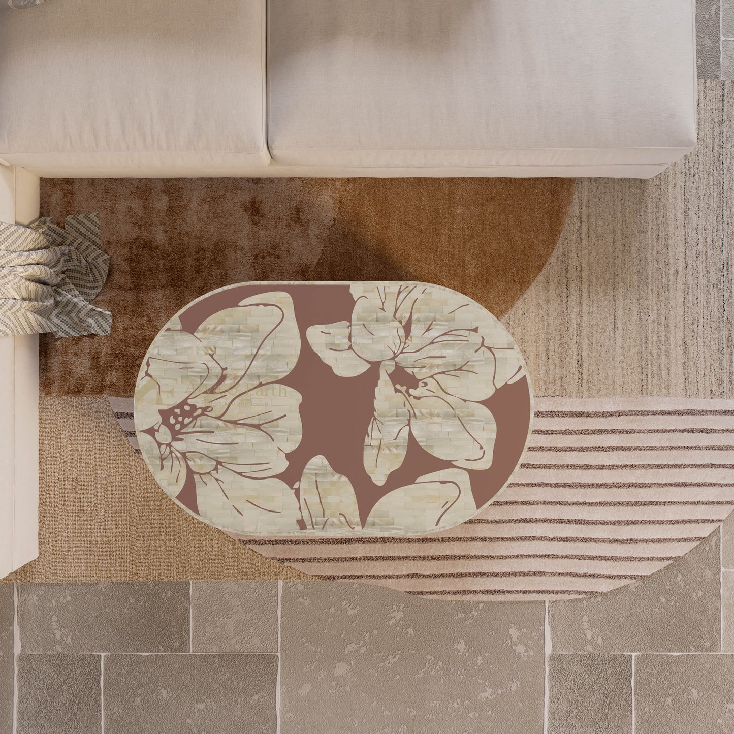 Floral mother of pearl coffee table  in terracotta colour on a neutral coloured rug