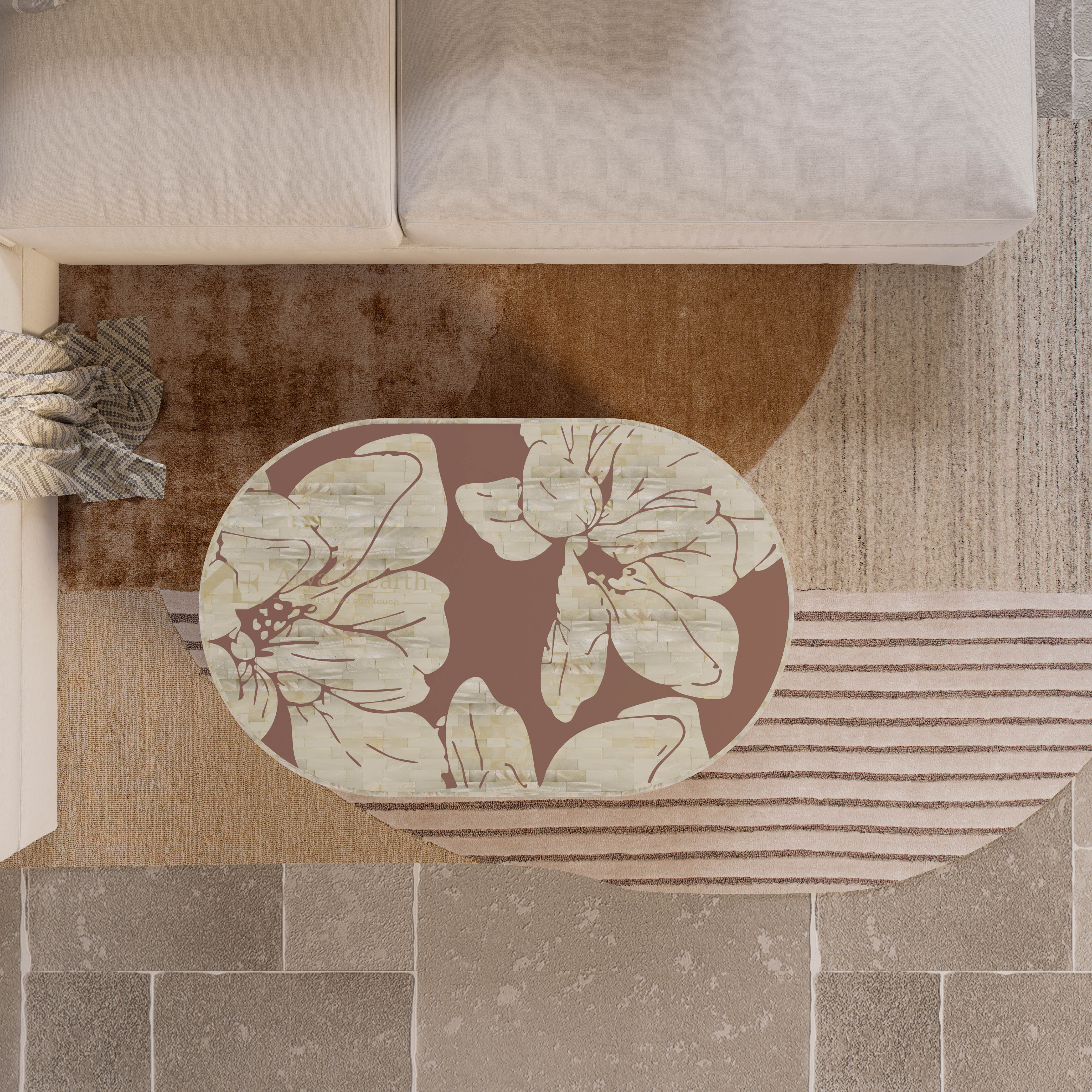 Floral mother of pearl coffee table  in terracotta colour on a neutral coloured rug