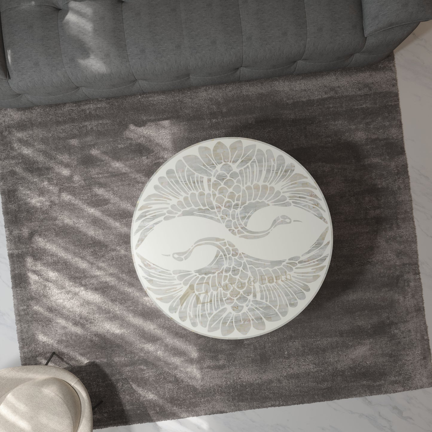 white pearl inlay pheonix design coffee table on a  rug