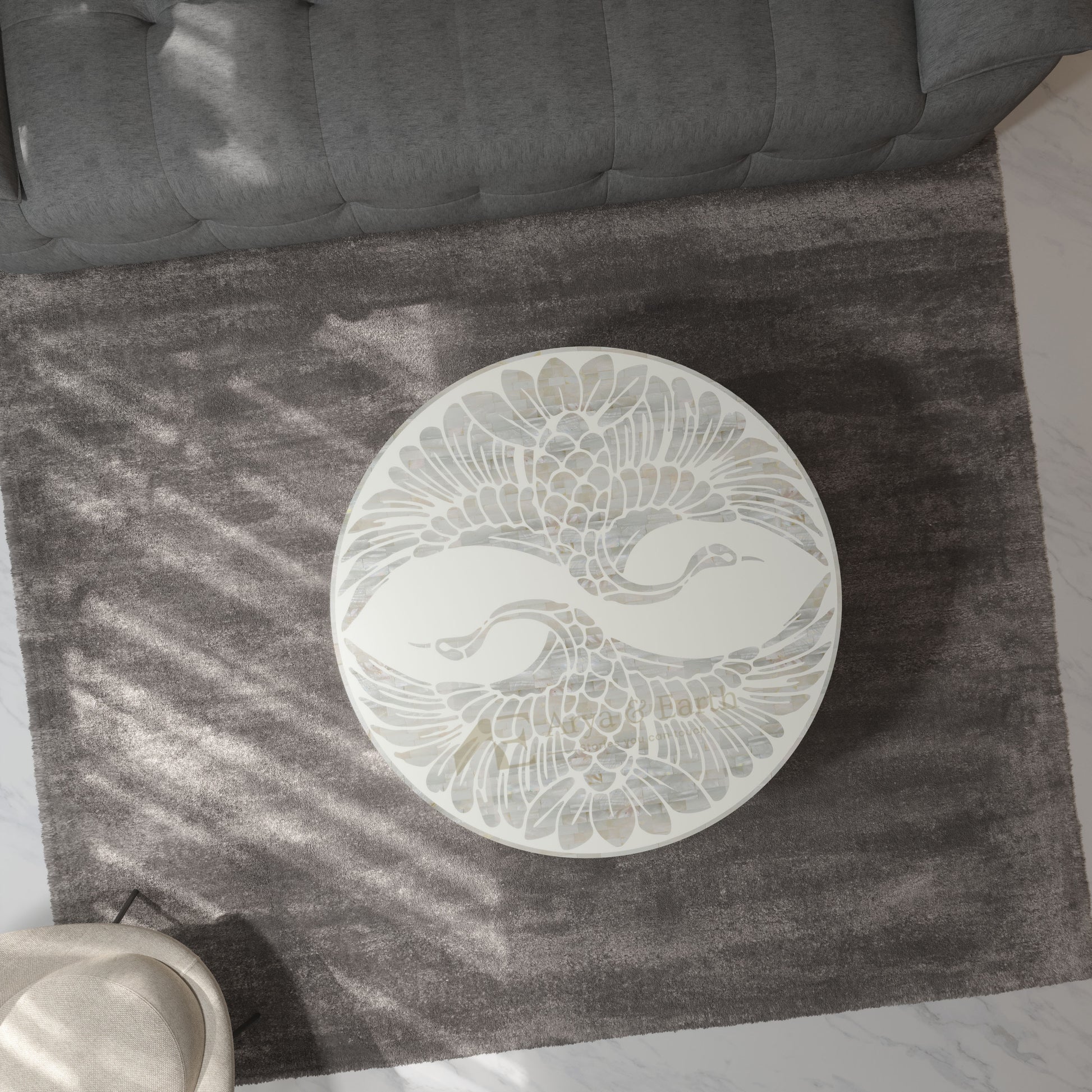 white pearl inlay pheonix design coffee table on a  rug