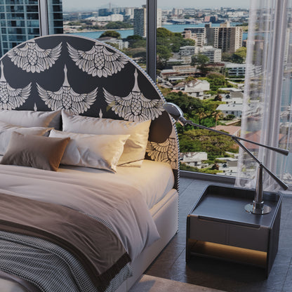 black headboard in a bedroom with city view
