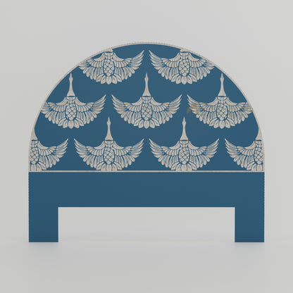 Decorative bone inlay headboard with winged pattern on a blue background