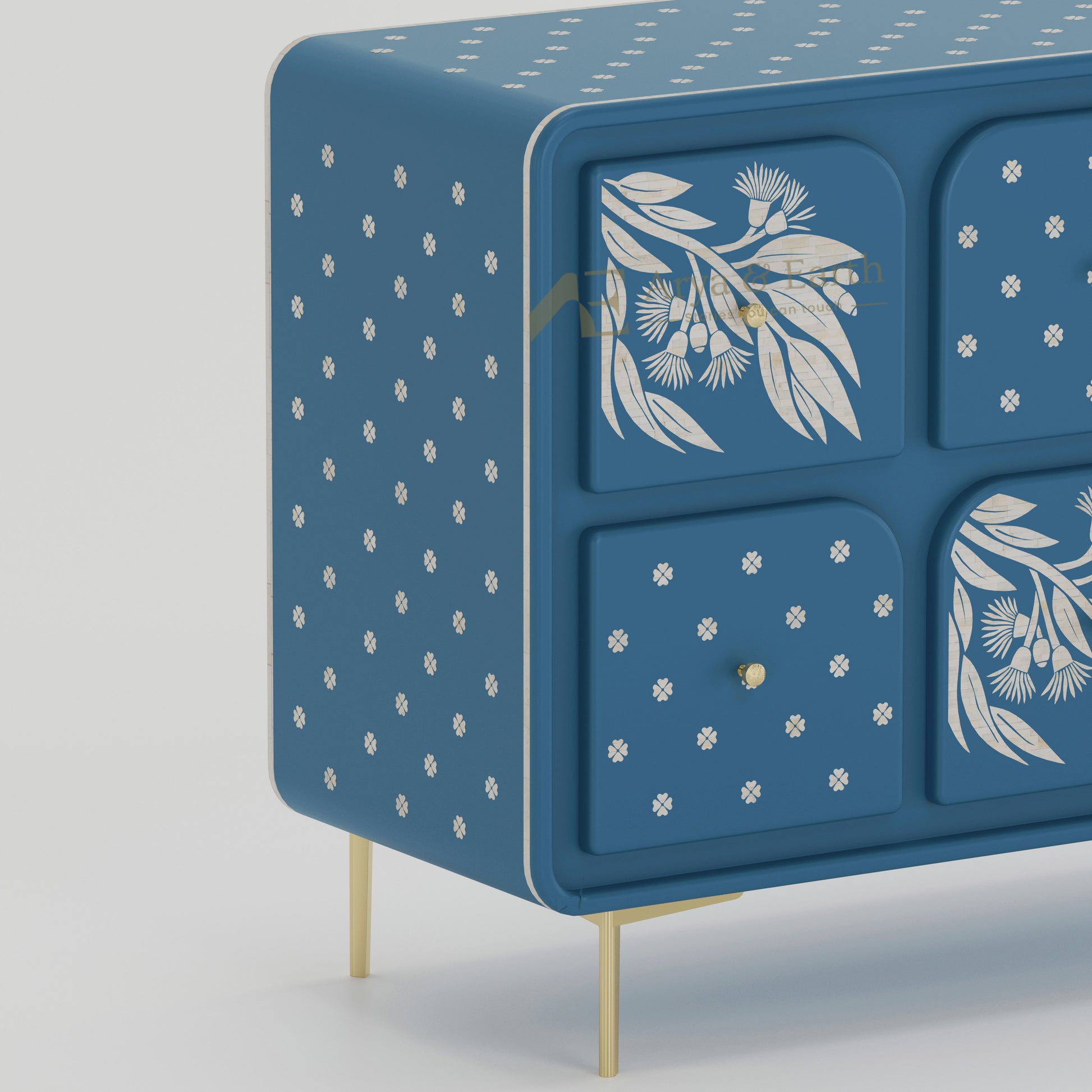Closeup of blue cabinet with floral and dot patterns