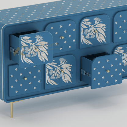 open drawers of blue bone inlay sideboard with floral patterns on a light grey background