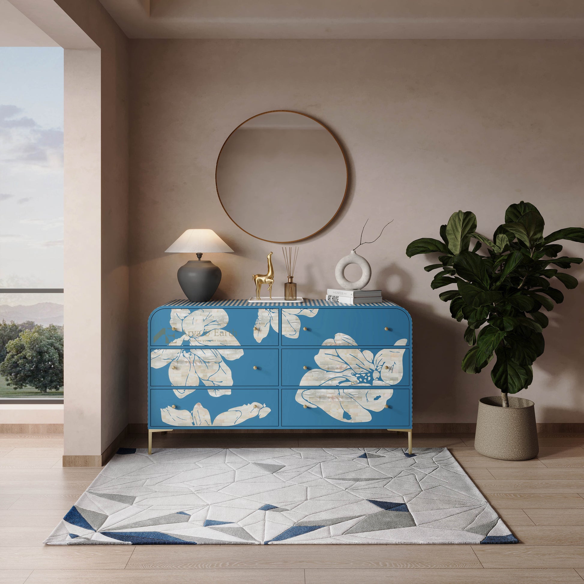Blue floral-patterned mother of pearl chest of drawers in a modern room with a plant and lamp.