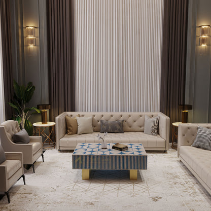 Modern living room with beige sofa, armchairs, and a bone inlay coffee table with decorative items.