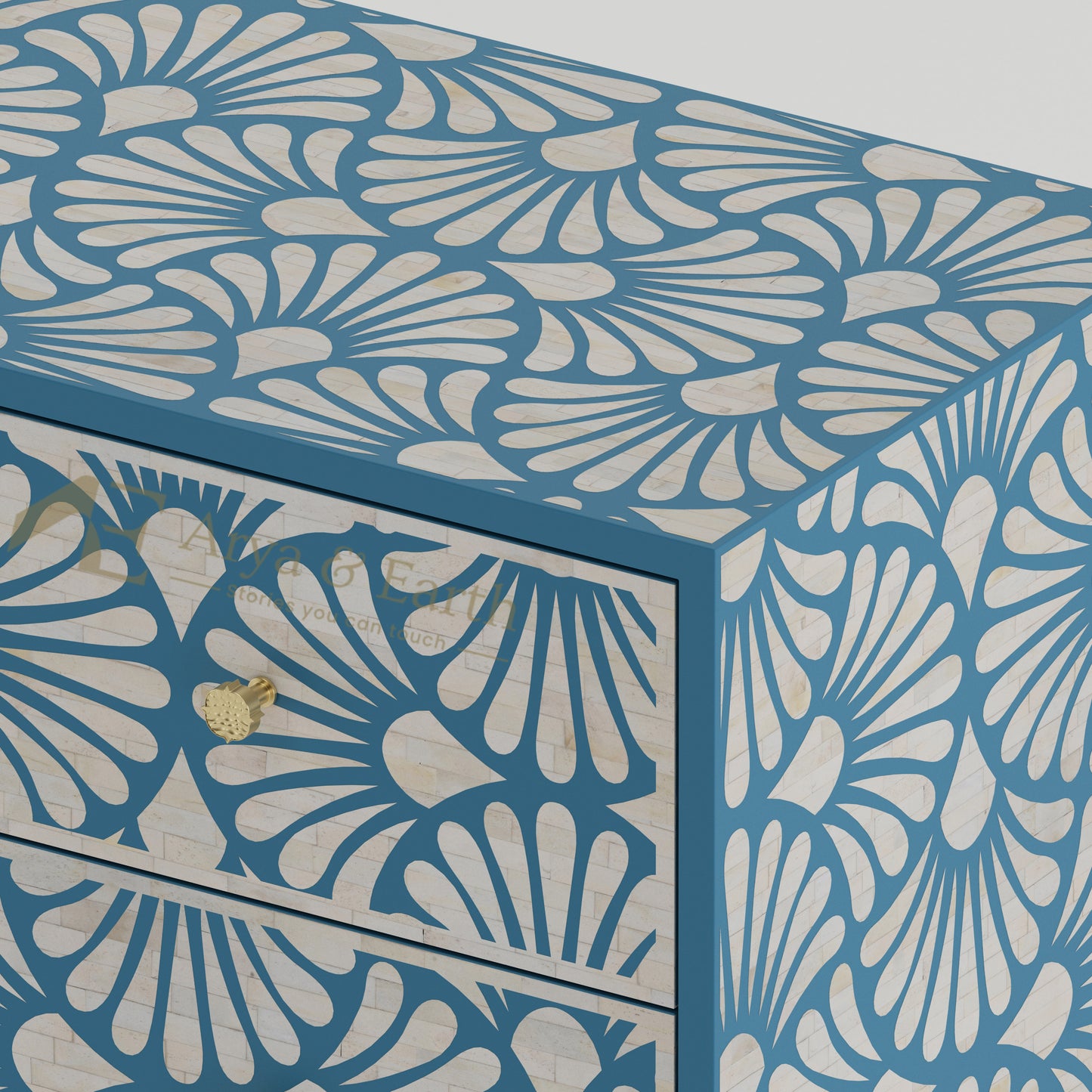 Closeup of bone inlay drawers with a blue and white floral pattern