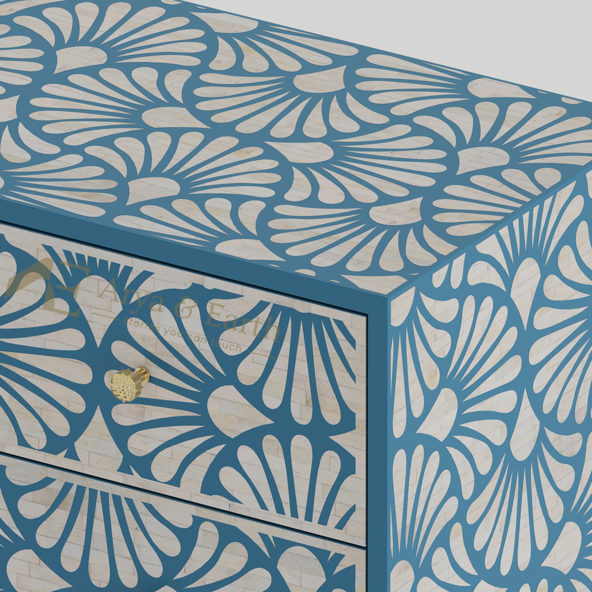 Closeup of bone inlay drawers with a blue and white floral pattern