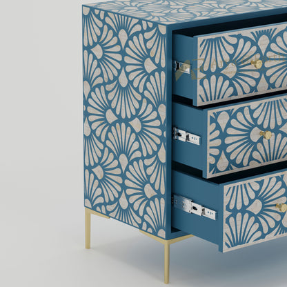 Open drawers on a blue dresser with white geometric pattern on a blue background