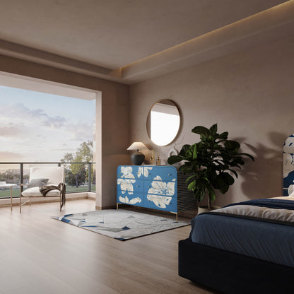 Modern bedroom with a blue and white patterned dresser, bed, and round mirror.