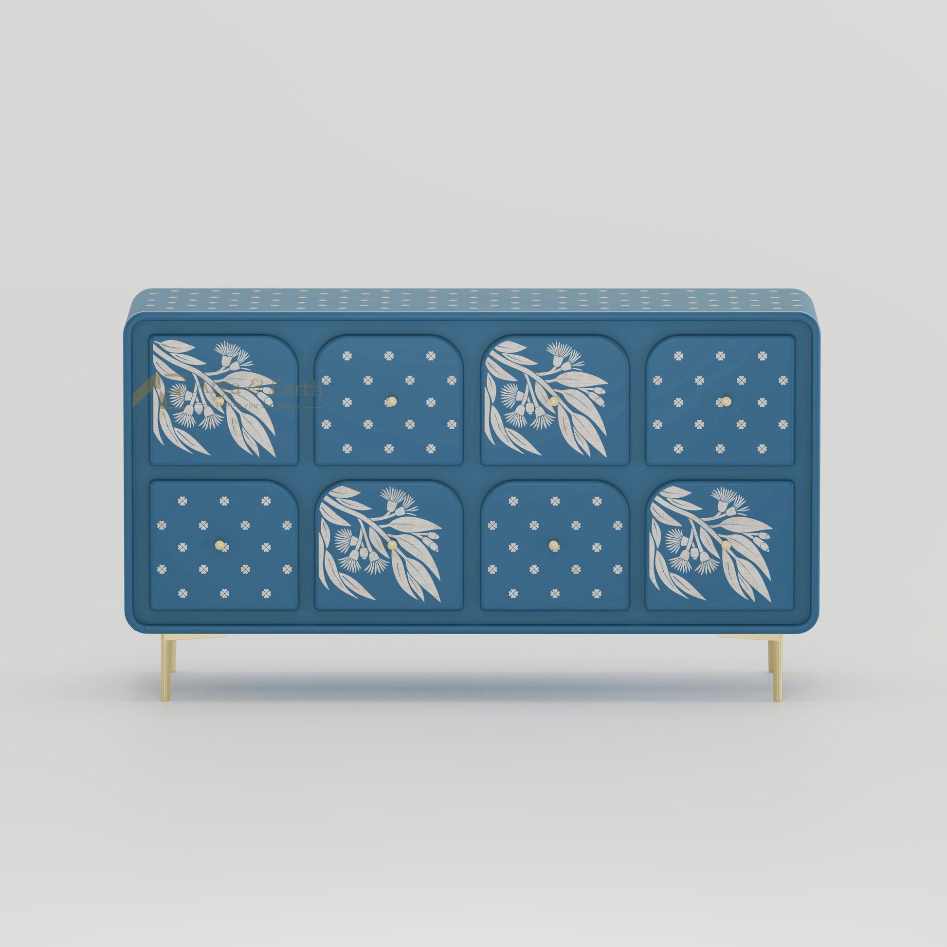 Blue sideboard with drawers with floral and geometric patterns on a light grey background