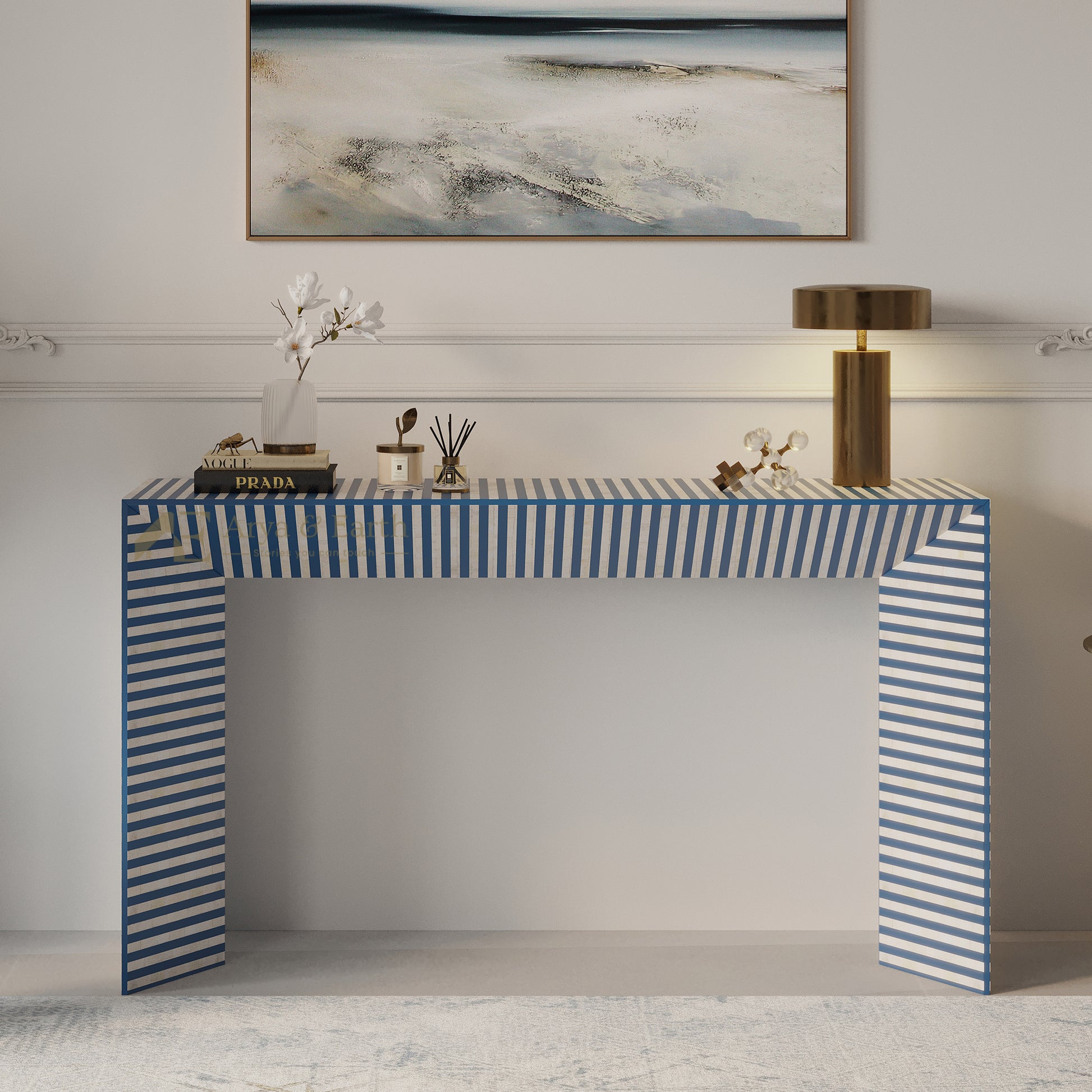 Blue and white striped console table in a room with abstract art on the wall.