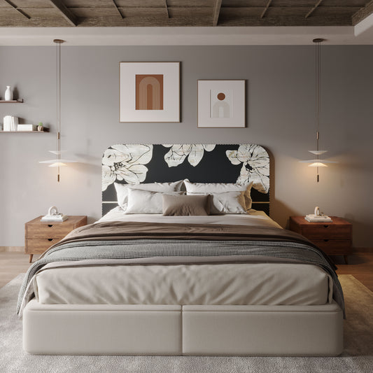 Modern bedroom with a bed featuring a floral black headboard, nightstands, and wall art.