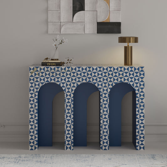 bone inlay console table with blue and white geometric pattern in a room setting.
