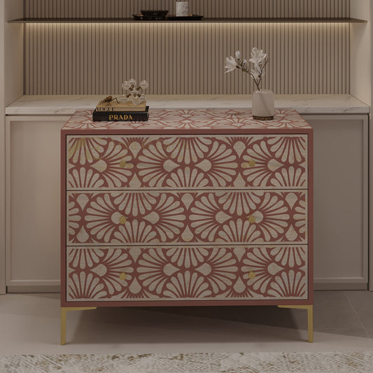 Decorative chest of drawers with a patterned design in a room setting.