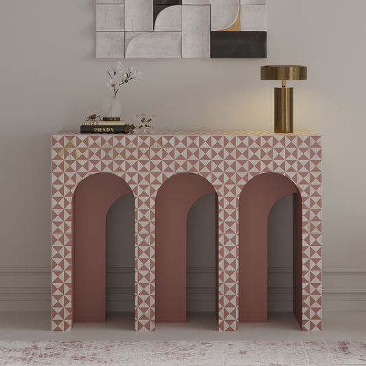 bone inlay console table with geometric pattern and gold lamp in a room setting.