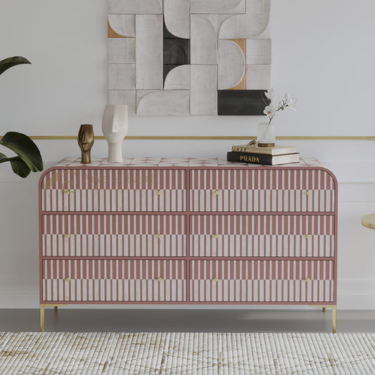  striped dresser in a stylish room with abstract art and decor.
