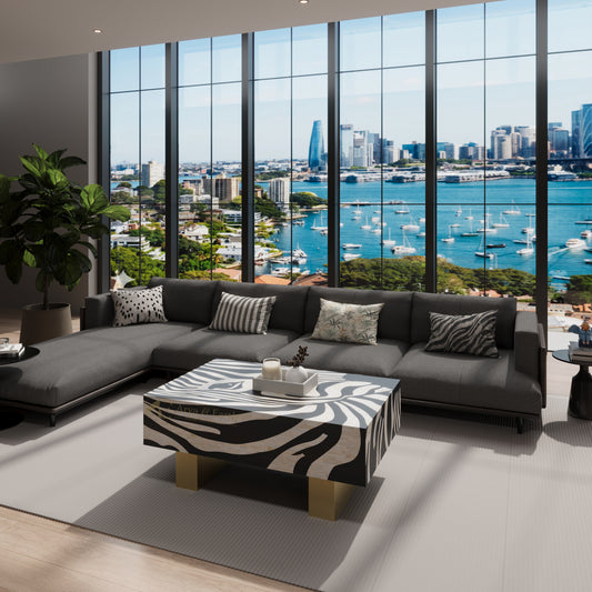 Luxury living room with a large sectional sofa and zebra-patterned  bone inlay coffee table, featuring a cityscape view through large windows.