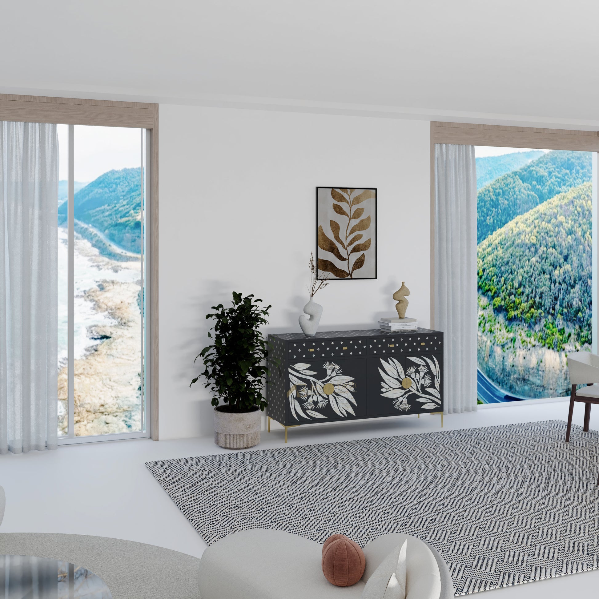 Modern living room with black cabinet and a view of mountains.