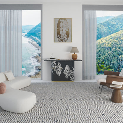 Modern living room with a scenic view of mountains and ocean through large windows with black console