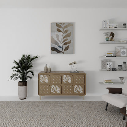 Modern living room with a beige bone inlay botanical drawer cabinet, plant, and wall art.