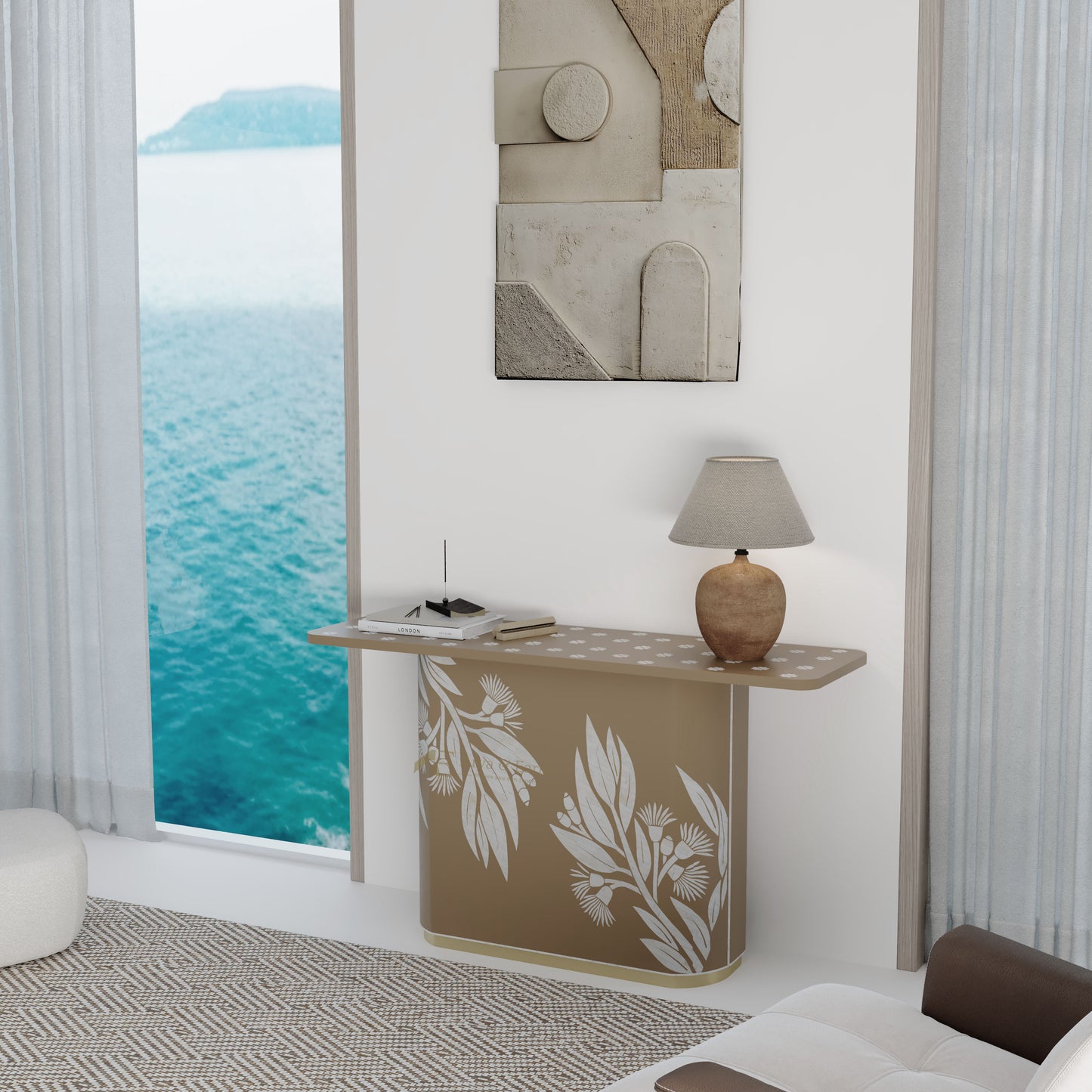 Modern interior with a beige console table, lamp, and abstract art on a wall with a view of water.
