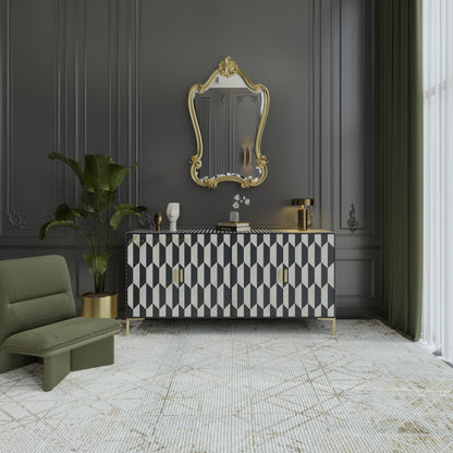 Art Deco style Modern interior with a black and white patterned cabinet, gold-framed mirror, and green sofa.