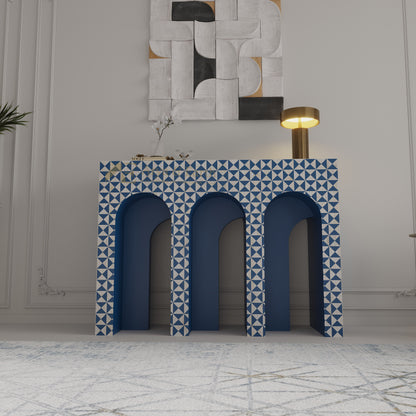 Bone inlay arched console with blue and white geometric pattern in a room with abstract wall art.