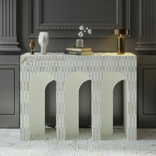 Mother of pearl inlay console table with checkered pattern against a dark wall